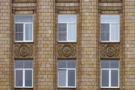 Fragment of facade building administrative government Belgorod region with USSR symbols. Ornament of the Stalinist Empire style of architecture.の写真素材