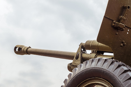 Vintage artillery barrel cannon. Military heavy artillery. Photo with limited depth of field.