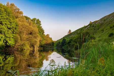 Summer landscape Root River. The river valley at the foot of the chalk hills archaeological monument...