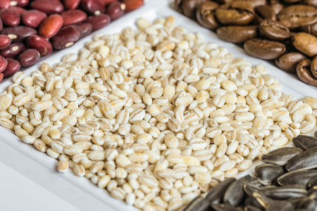 Pearl barley close-up in set of groceries. Food product background with limited depth of field.の写真素材