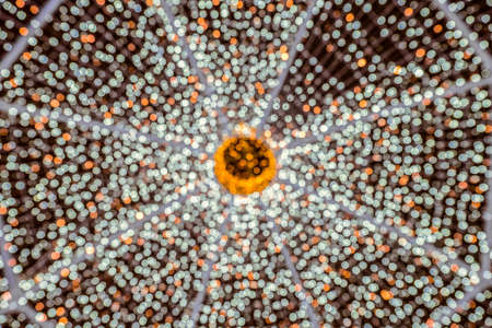 Blurred abstract christmas background with many LED lights. Bright light bokeh at Night.の写真素材