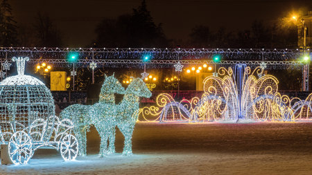 Belgorod, Russia - January 8, 2017: New Year's Cathedral Square with christmas decorations in the center of Belgorod city. LED light horses with a carriage decoration composition.のeditorial素材
