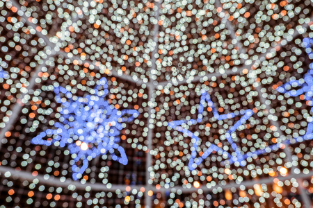 Blurred abstract christmas LED illumination background. Bright light nighty bokeh.の写真素材
