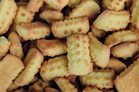 Sweet baked biscuits background. Confectionery cookie close-up. Shortbread.