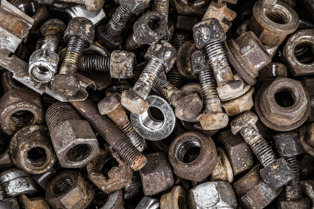 Metal screw-nuts. Fasteners background.