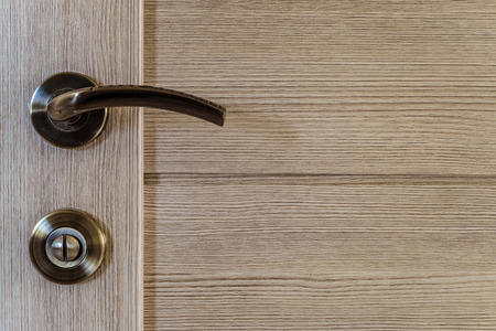 Interroom laminated door with door knob and lock close-upの写真素材