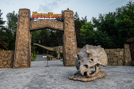 Belgorod, Russia - May 31, 2019: Main entrance, square and ticket office to Belgorod city Dino Park. Evening light.のeditorial素材