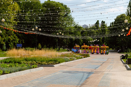 Belgorod, Russia - Jule 28, 2020: Alley in Victory Park (public park pobedy) on a weekday. Cityscape.のeditorial素材