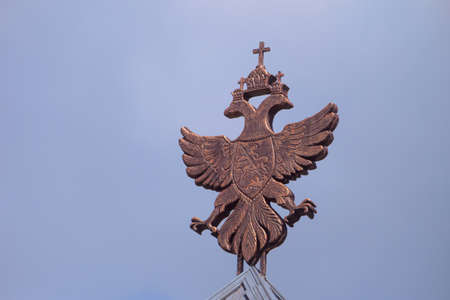 Historical coat of arms of the Russian Empire on wooden roofの写真素材