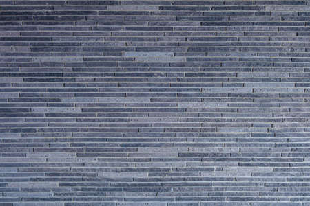 Facing decorative brick on wall. Gypsum facing tile for interior decoration inside house.の写真素材