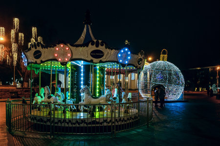 Belgorod, Russia - January 05, 2021: Sobornaya (Cathedral) Square with new year decorations and carousel in the center of Belgorod city.のeditorial素材