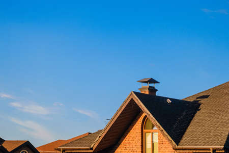 Valley roofing with attic window. Detail of pitched roof with soft sheathing.