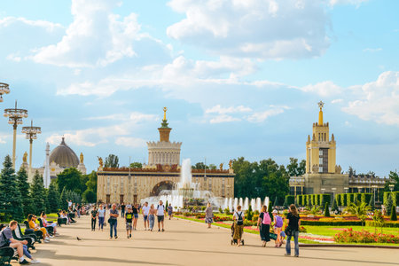 Moscow, Russia - July 21, 2021: Main alley on VDNH park. View of pavilion number 58 - Center Slavic writing "Word" (slovo), fountain "Stone flower" and pavilion number 59 - Polytech (formerly Grain).のeditorial素材