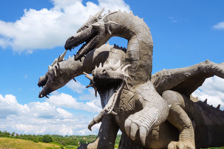 Lipetsk region, Russia - July 14, 2022: Monument of Russian fairytale three-headed dragon Zmey Gorynych. Three heads with open mouths. Wonderland natural park Kudykina Gora (Kudykina mountain).のeditorial素材