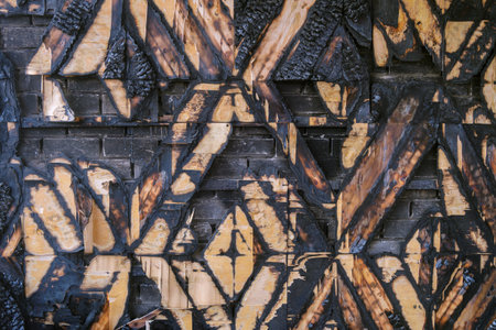 Charred wooden wall finishing surface. Decoration interior after fire.の写真素材