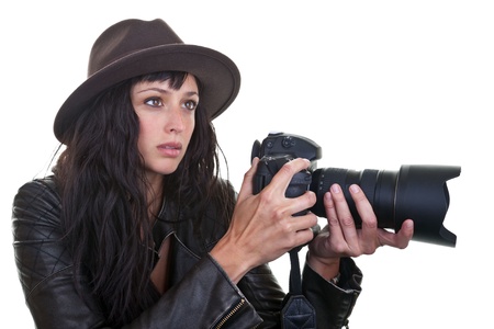 Attractive young woman taking photos with a large DSLR 