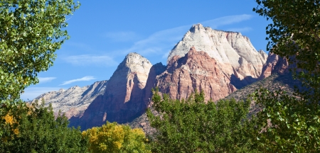 Sandstone peaks framed by early fall foliage in Zion Canyon National Park, Utah の写真素材