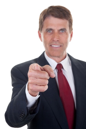 Handsome middle aged businessman pointing his finger and smiling - selective focus on the finger.の写真素材