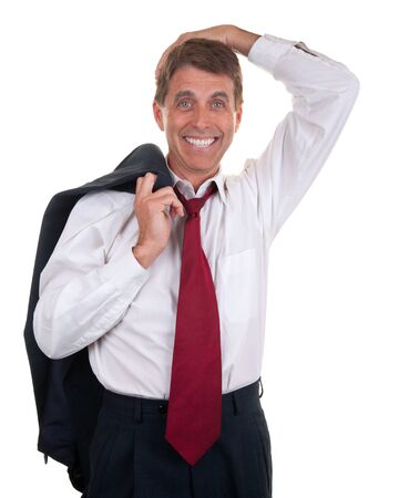 Attractive middle aged businessman in a relaxed pose with jacket slung over his shoulder, happy to leave work for the day.の写真素材