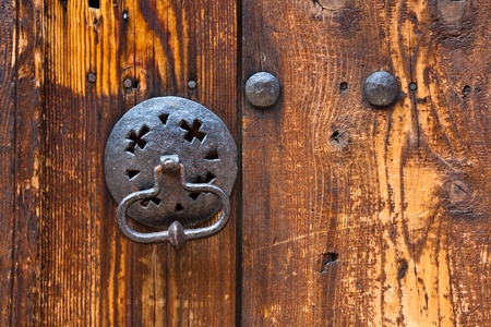 Metal knocker on an old wooden door in Plovdiv, Bulgaria.の写真素材