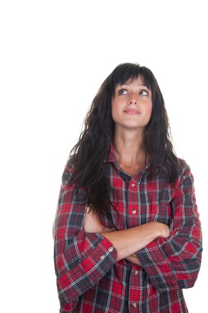 Pretty young woman in a casual checkered shirt looking up.の写真素材