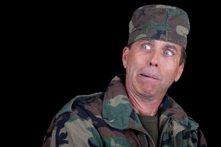 Casual soldier making a silly face in surprise or fear.の写真素材