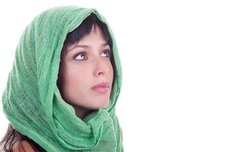 Beautiful female model with a green shawl wrapped around her head, isolated on white.の写真素材