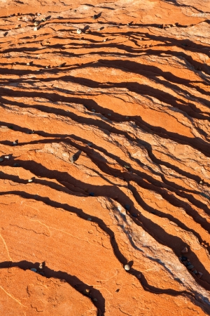 Abstract background of red rock and pebbles pattern.の写真素材