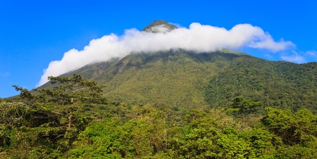 A ring of clouds surrounds Arenal Volcano in Costa Rica 