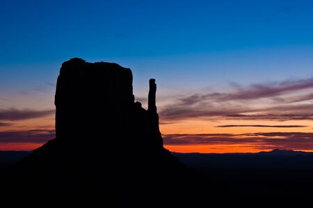 West Mitten butte silhouette at sunrise in Monument Valley Tribal Park, Arizona.の写真素材