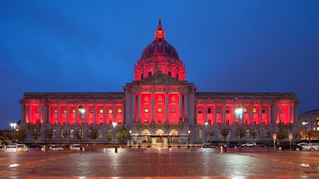 Panorama of San Francisco City Hall illuminated by red light.の写真素材