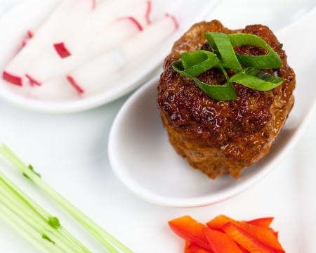 Closeup view of a gourmet meatball appetizer plate の写真素材