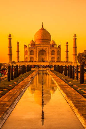 Classic view of Taj Mahal with reflections in a pond in Agra, India.の写真素材