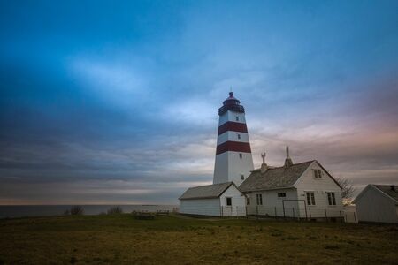 The lighthouse is on the right side of the frame. Northern nature of Norway.