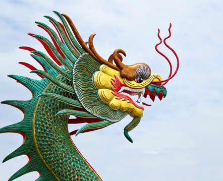 Colorful of Dragon head statue on the roofの写真素材