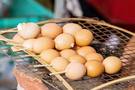 Group of Grilled chicken eggs on the grill, close upの写真素材