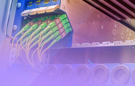 Server with set of green fiber optic cables in data centerの写真素材