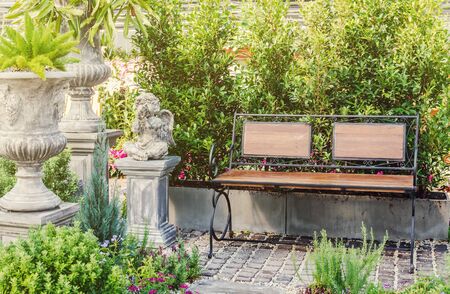 Wood bench decorate in beautiful flower gardenの写真素材