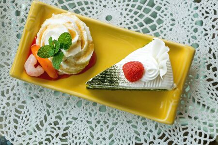 Top view of fresh mint and green tea cake on plate, close upの写真素材