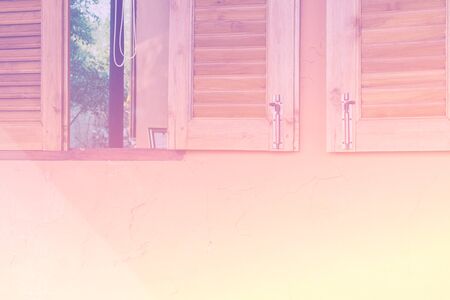 Opened wood window on the old grunge yellow background - Color filter effect style pictures