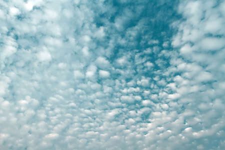 Fluffy white clouds flying on blue sky background