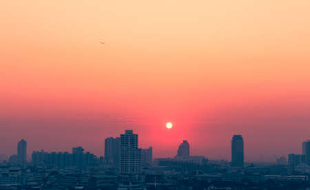 Sunset city scenery with sun and building in Bangkok; Thailandの写真素材