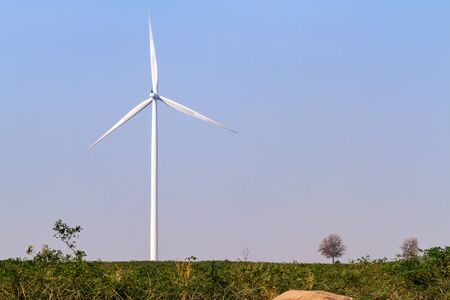Wind turbine power generator over blue skyの写真素材
