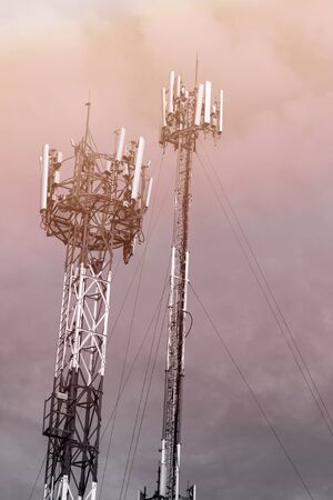 Mobile phone towers over cloud sky in rural areas - color filter effect style pictures