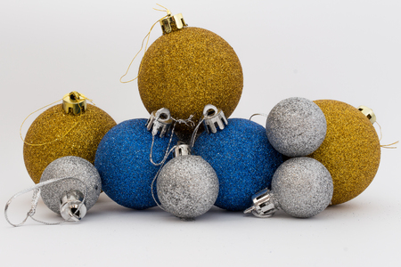 Silver, gold and blue shiny Christmas balls isolated on white backgroundの写真素材