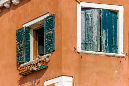 Old Windows on corner houseの写真素材