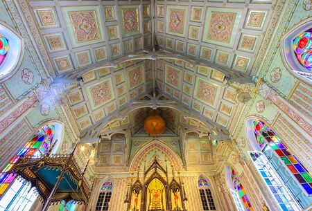 The interior of assembly hall of Wat Niwet Thammaprawat,Ayutthaya province,Thailand.This Buddhist temple was built and decorated in the Gothic style.The only things that are made in traditional style are Buddha statues.It is a public temple.のeditorial素材