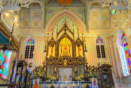 The interior of assembly hall of Wat Niwet Thammaprawat,Ayutthaya province,Thailand.This Buddhist temple was built and decorated in the Gothic style.The only things that are made in traditional style are Buddha statues.It is a public temple.のeditorial素材