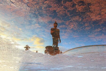 Reflection shadow of Buddha statue at Phutthamonthon(Buddhist park in the Phutthamonthon district, Nakhon Pathom Province of Thailand, west of Bangkok)の写真素材