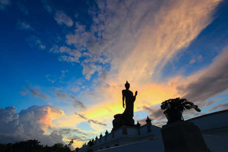 sunset sky and Buddha statue at  Phutthamonthon(Buddhist park in Nakhon Pathom Province of Thailand)の写真素材